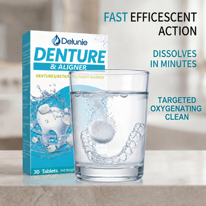 Delunie denture and aligner cleaning tablet dissolving in water beside a clear aligner